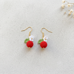 Micro Crochet Berry Earrings flat lay with dried flowers