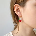 Woman wearing micro crochet berry earrings