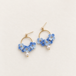 Blue micro crochet hydrangea hoop earrings with pearl drops, pair on ivory background