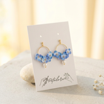 blue Micro Crochet Hydrangea Hoop Earrings on Petalore display card