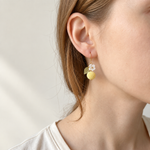 Petalore Lemon Yellow berry micro crochet earrings — close-up wearing view 