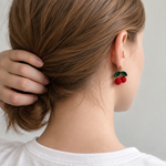 Micro crochet cherry earrings — rear wearing view