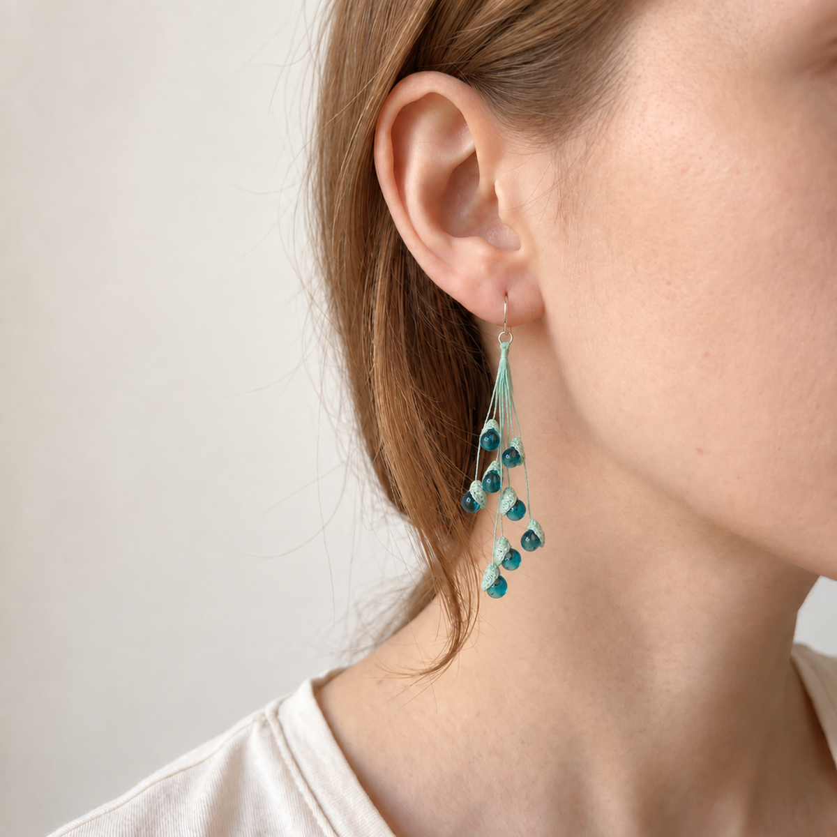 Petalore Blue lily of the valley micro crochet earrings — close-up wearing view 