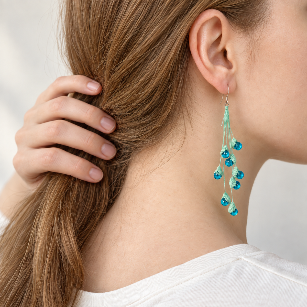 Petalore Blue lily of the valley micro crochet earrings — rear wearing view 