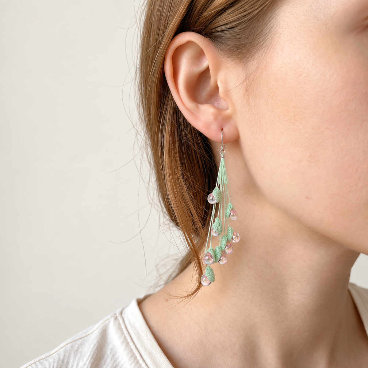 Petalore Pink lily of the valley micro crochet earrings — close-up wearing view 