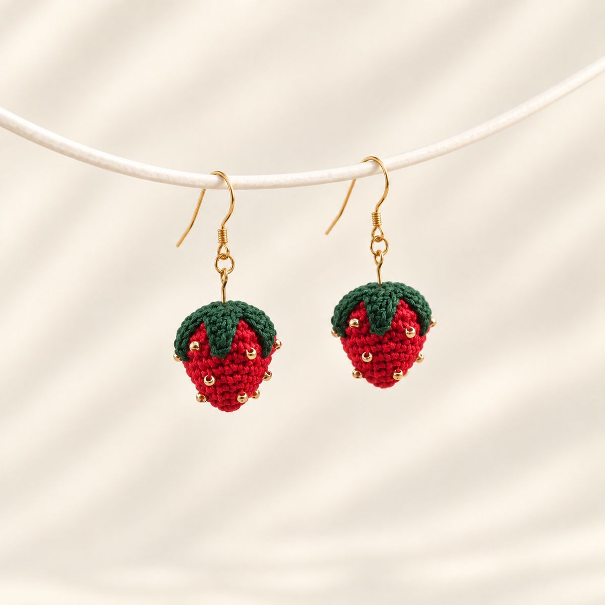 Micro crochet strawberry earrings — main view