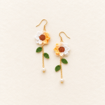Petalore cream white and pale yellow micro crochet sunflower earrings — pair with green leaves, delicate gold chains and pearl drops