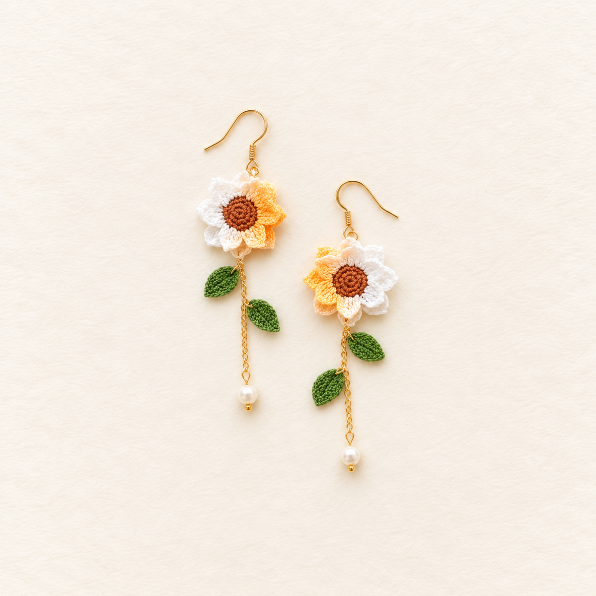 Petalore cream white and pale yellow micro crochet sunflower earrings — pair with green leaves, delicate gold chains and pearl drops